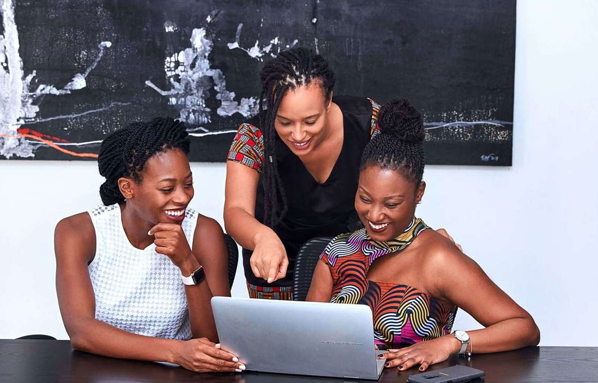 South African executives working at computer.